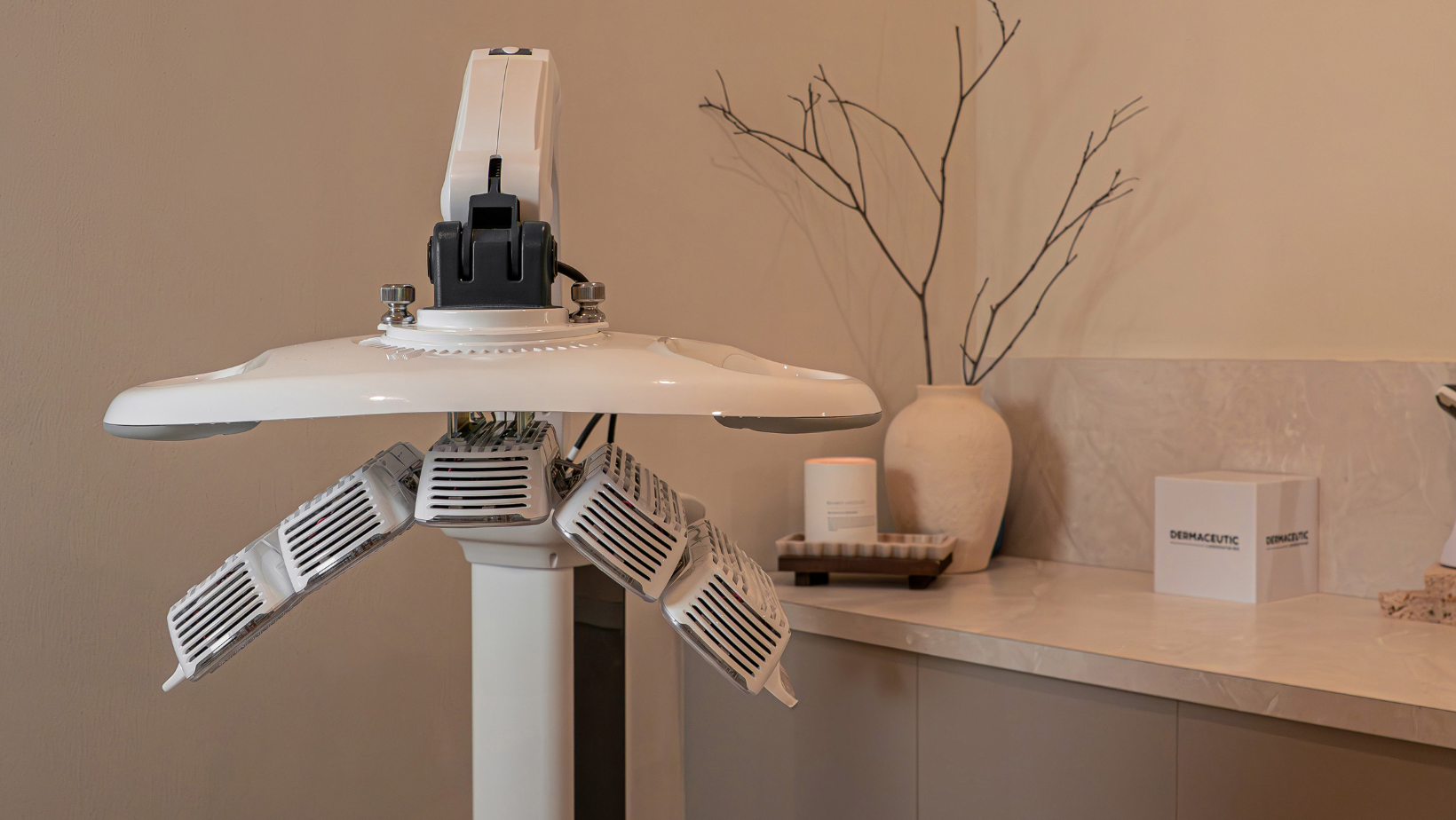 Robotic arm on a stand with a neutral background